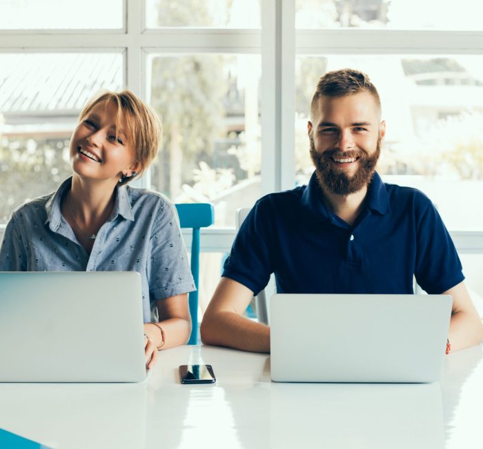 Couple In Cafe With Laptop